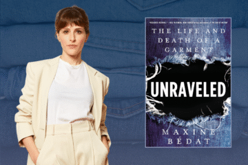 A person wearing a cream-colored blazer and white shirt stands next to the book cover of "Unraveled: The Life and Death of a Garment" by Maxine Bédat, with a denim background.
