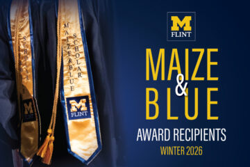Image of graduation stoles with the text "MAIZE & BLUE" and "SCHOLAR" on them, alongside the logo for the University of Michigan-Flint. The text "AWARD RECIPIENTS WINTER 2026" is also included.