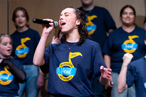 A singer performing holding a microphone