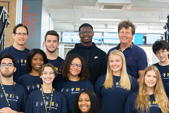 A group of faculty and K-12 campers posing for a photo
