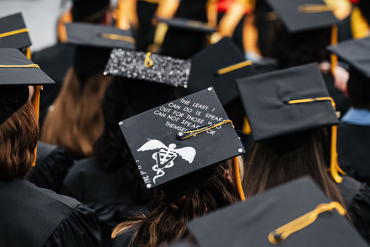 FLINT_Winter Commencement Caps April 2026_0025 Graduation cap with the text "The least I can do is speak out for those who can not speak for themselves" and a medical symbol.