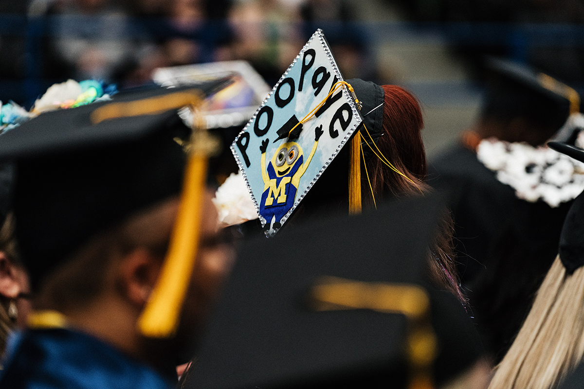 FLINT_Winter Commencement Caps April 2026_0034 Graduation cap decorated with a Minion character