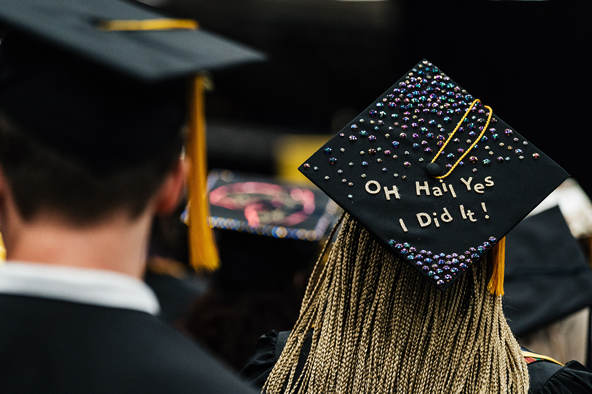 FLINT_Winter Commencement Caps April 2026_0035 Graduation cap decorated with colorful rhinestones and the words "OH Hail Yes I Did It!"
