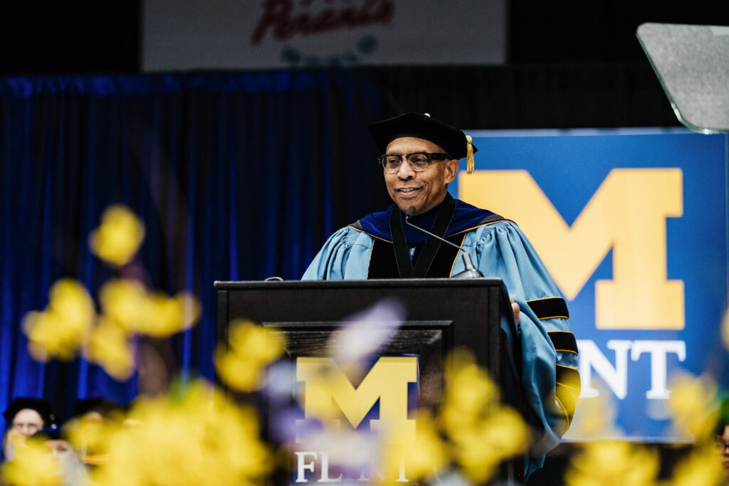 Chancellor Laurence B. Alexander speaking at the lectern. 
