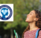 A young woman with curly hair smiles and looks up, holding green notebooks. A logo above her reads "Excellence in Mental Health and Wellbeing 2026."