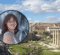 A portrait of a woman with wavy brown hair, smiling, is overlaid on a scenic view of ancient ruins with columns and stone structures under a blue sky.