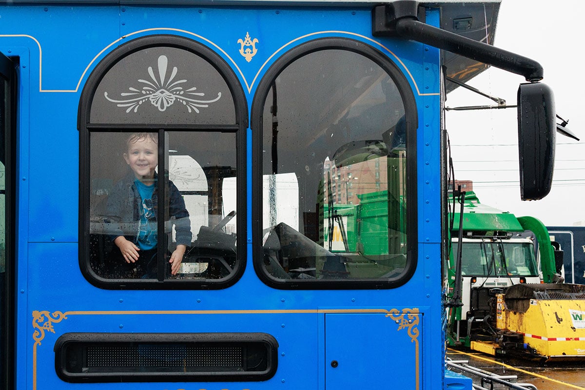 FLINT_TOUCH A TRUCK 2026_0004 Attendees explore emergency and service vehicles during the University of Michigan-Flint Department of Public Safety Touch-a-Truck event.