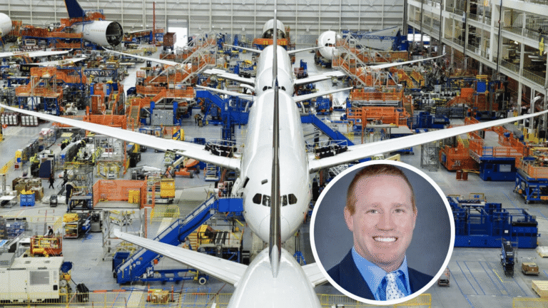 An aircraft manufacturing facility with multiple planes in various stages of assembly. A circular inset shows a smiling man with short red hair wearing a blue suit.
